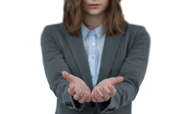 Businesswoman gesturing against white background — Stock Photo, Image