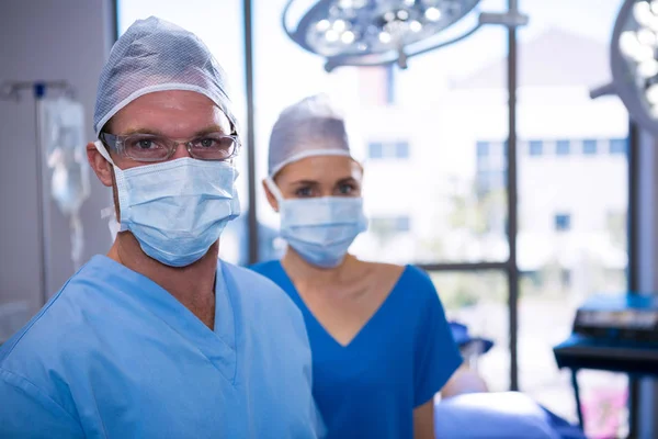 Male and female nurse wearing surgical mask — Stock Photo, Image