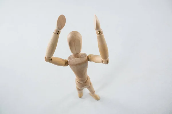 Statuetta in legno con le mani alzate — Foto Stock