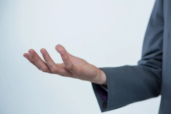 Businessman offering a helping hand — Stock Photo, Image