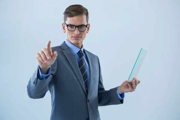 Businessman holding glass sheet — Stock Photo, Image