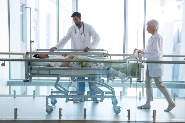 Doctor pushing emergency stretcher bed — Stock Photo, Image