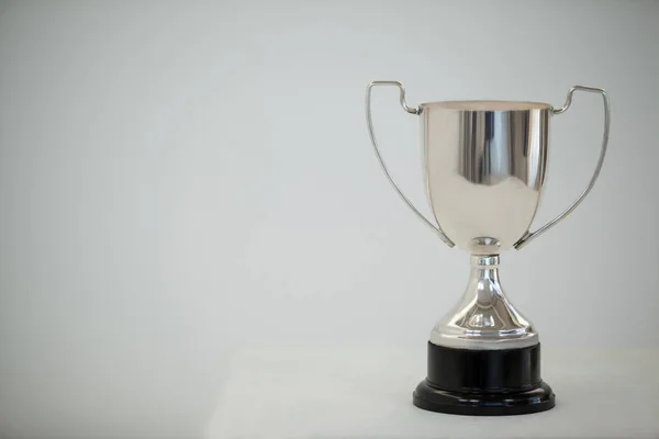 Silver trophy on grey background — Stock Photo, Image