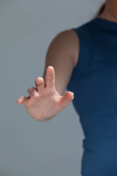 Hand of a woman touching invisible screen — Stock Photo, Image