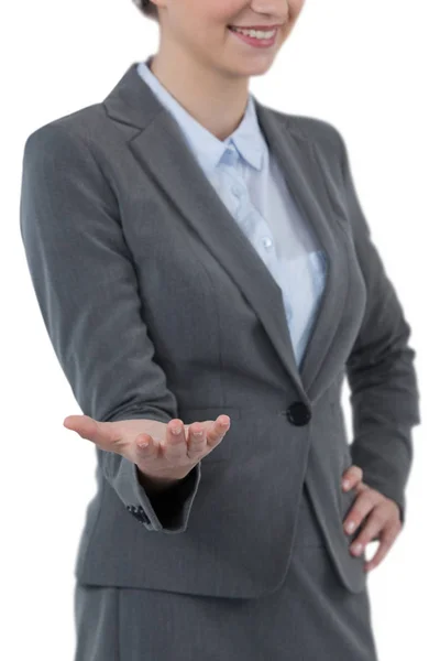 Businesswoman gesturing against white — Stock Photo, Image