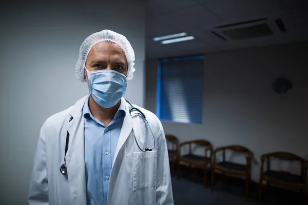 Portrait of male doctor standing in corridor — Stock Photo, Image