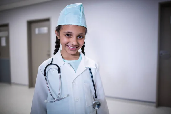 Miling girl pretending to be a doctor — Stock Photo, Image