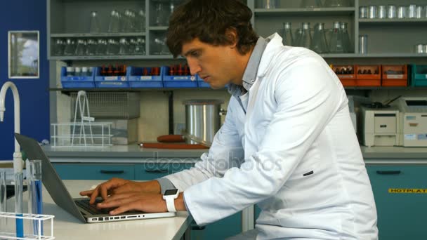 Scientist using laptop — Stock Video