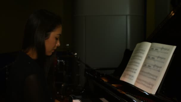 Woman playing a piano — Stock Video