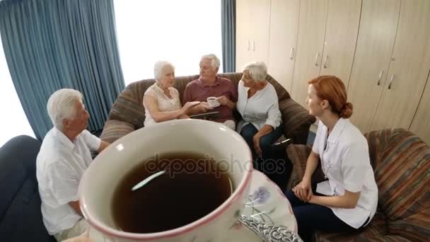 Smiling doctor and patients talking — Stock Video