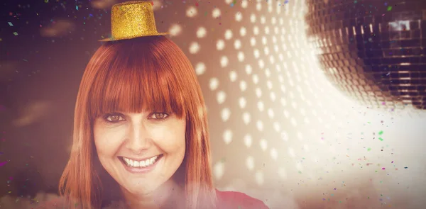 Composite image of smiling hipster woman with party hat — Stock Photo, Image