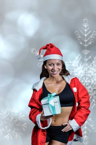 Noel hediyesi tutan atlet — Stok fotoğraf