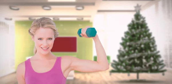 Blonde lifting dumbbell and flexing — Stock Photo, Image