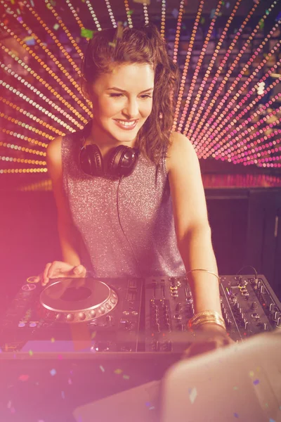 DJ playing music against flying colours — Stock Photo, Image