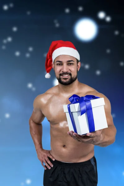 Uomo muscoloso in cappello di Babbo Natale — Foto Stock