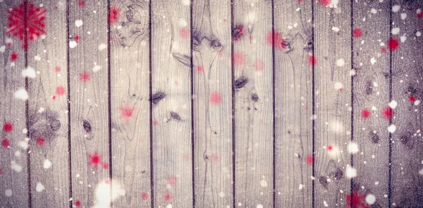 Сніжинки проти дерев'яного паркану — стокове фото