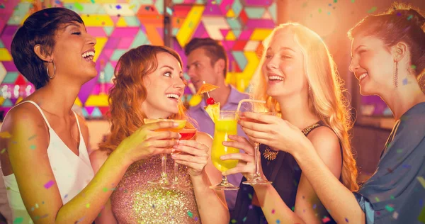 Friends having glass of cocktail in bar a — Stock Photo, Image