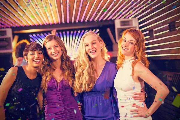 Female friends standing together in bar — Stock Photo, Image