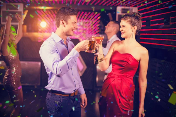 Couple toasting glass of beer and cocktail a — Stock Photo, Image