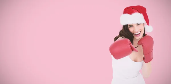 Brunette in boxing gloves punching — Stock Photo, Image