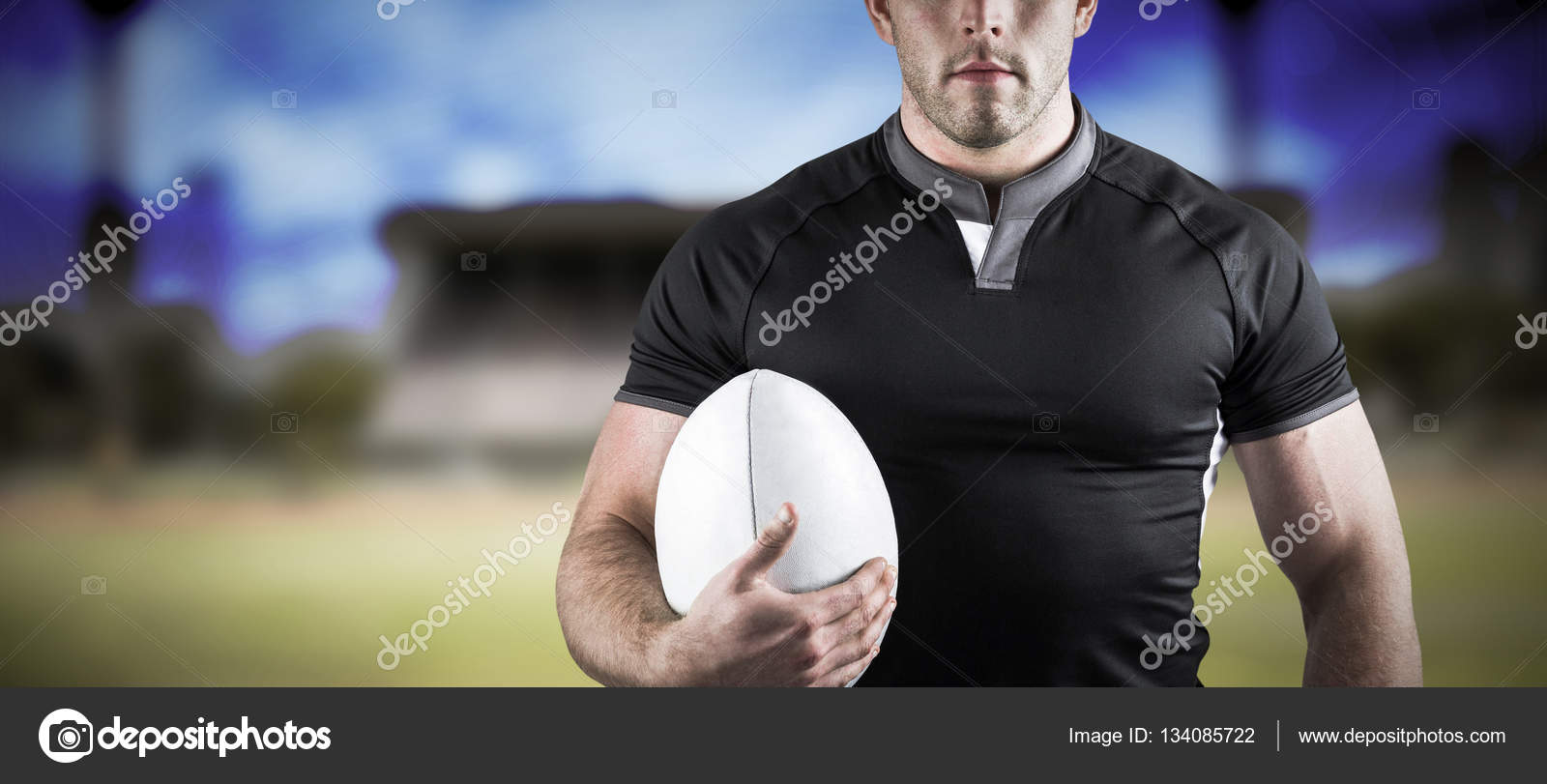 Tough rugby player holding ball — Stock Photo © Wavebreakmedia 134085722