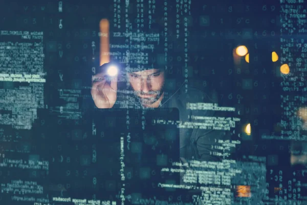 Hacker using laptop in dark room — Stock Photo, Image