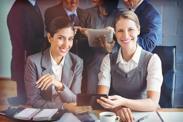Businesswomen using digital tablet — Stock Photo, Image