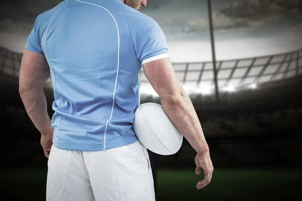 Rugby player standing with ball — Stock Photo, Image