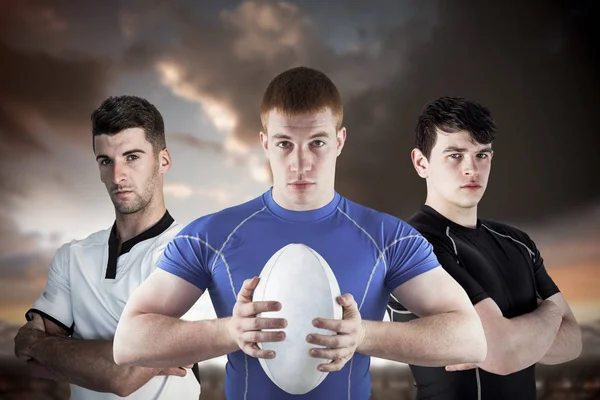 Composietbeeld van stoere rugbyspelers — Stockfoto