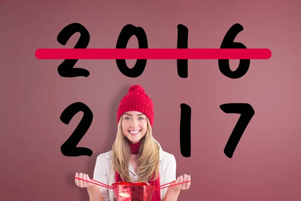 Blonde opening gift bag — Stock Photo, Image