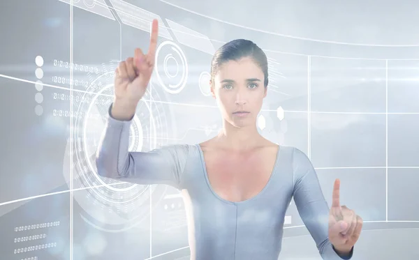 Vrouw gebaren tegen futuristische technologie interface — Stockfoto