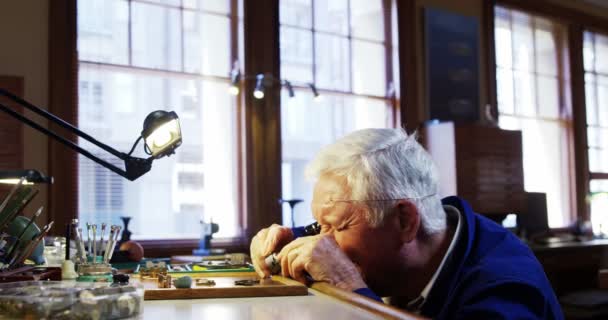 Horologist repairing a watch — Stock Video