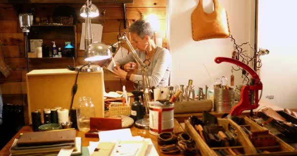 Attentive craftswoman working — Stock Video