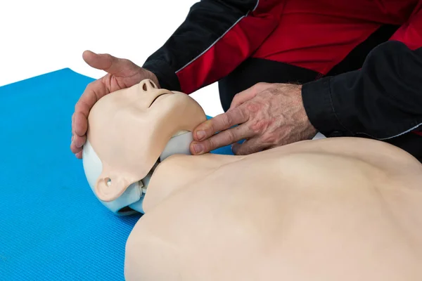 Paramedic practicing resuscitation on dummy — Stock Photo, Image