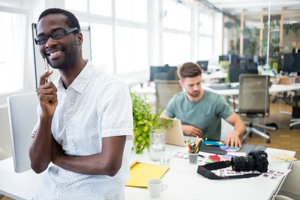 Graphic designer standing with pen — Stock Photo, Image