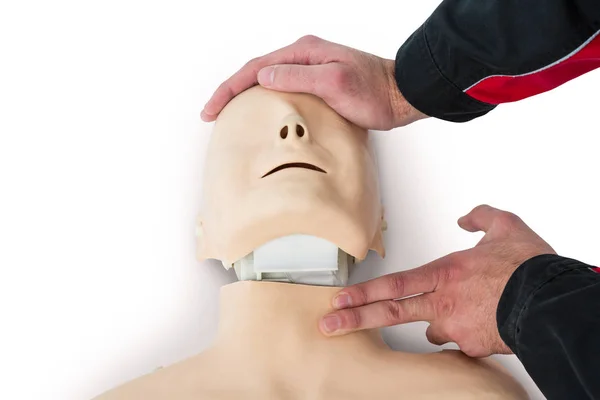 Paramedic practising resuscitation on dummy — Stock Photo, Image
