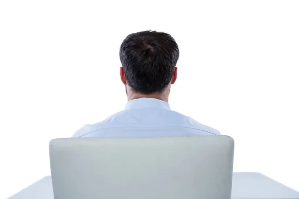 Uomo d'affari seduto su una sedia — Foto Stock