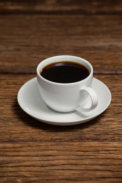 Kopje koffie op houten tafel — Stockfoto