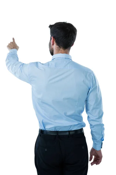 Businessman pretending to touch an invisible screen — Stock Photo, Image