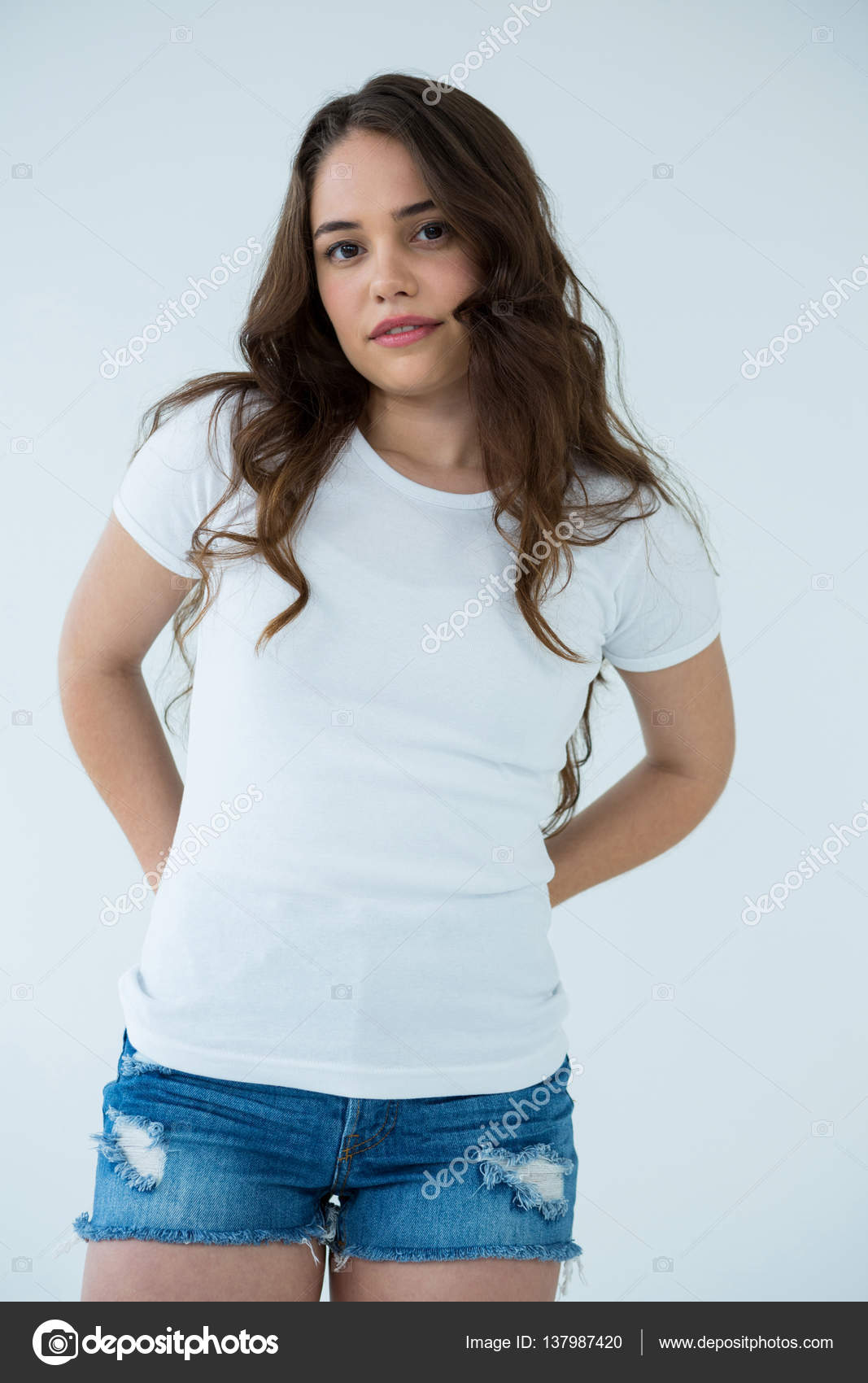 Woman in white t shirt and hot pants Stock Photo by