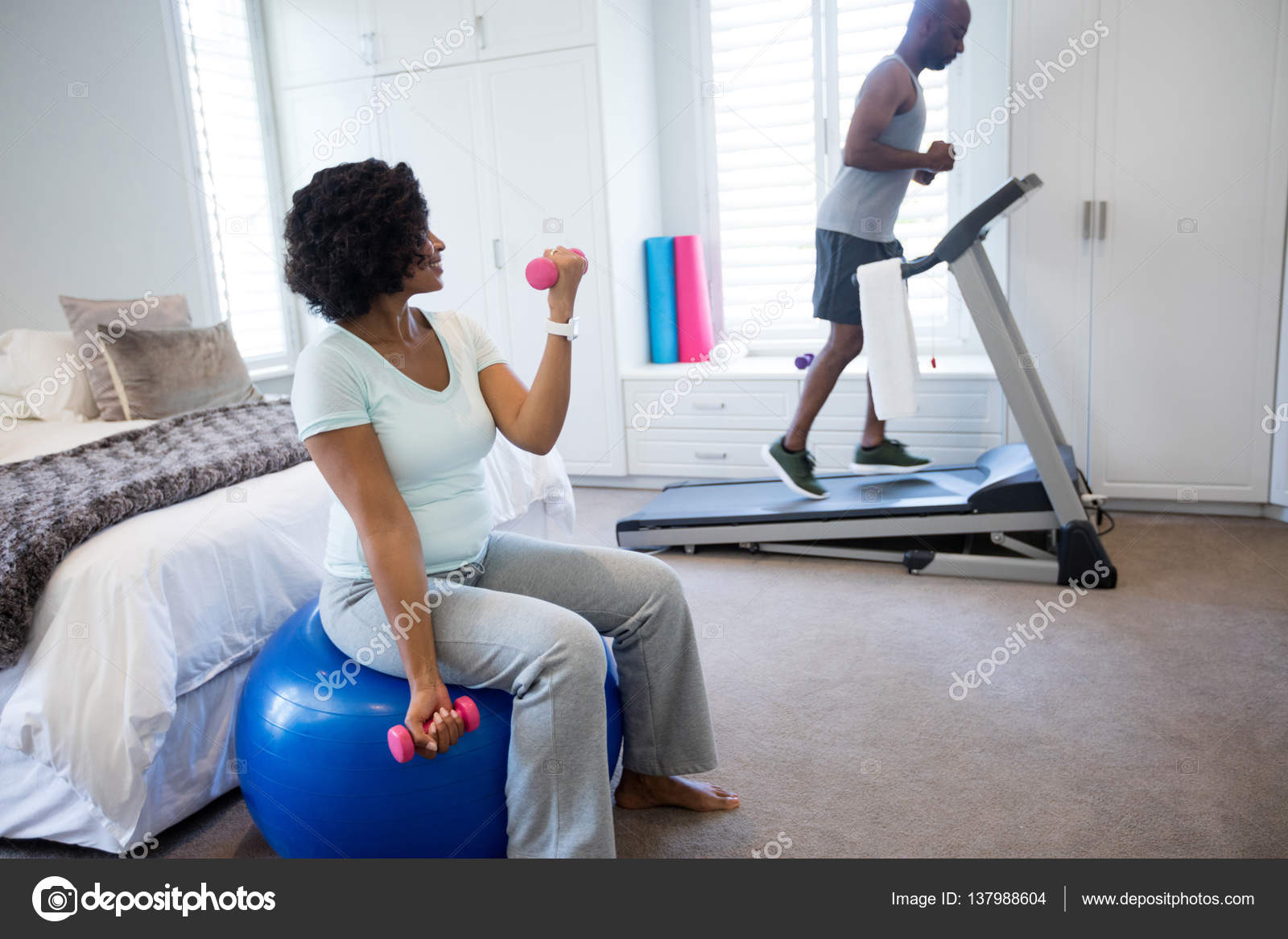 Man running on treadmill in bedroom Stock Photo Wavebreakmedia 137988604