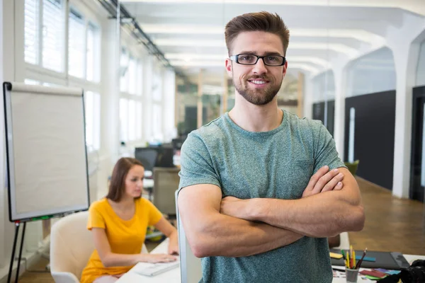 Graphic designer standing with arms crossed — Stock Photo, Image