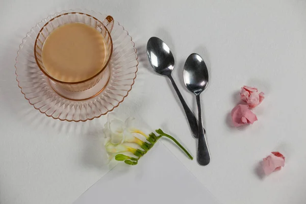 Cup of tea, spoons, blank page, paper balls — Stock Photo, Image