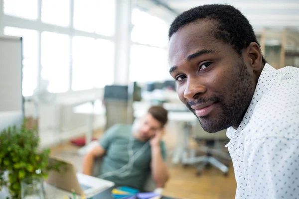 Graphic designer smiling at camera — Stock Photo, Image