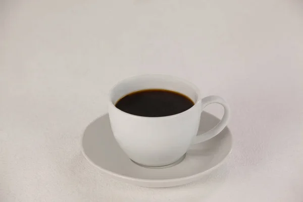 Kopje koffie op schotel — Stockfoto