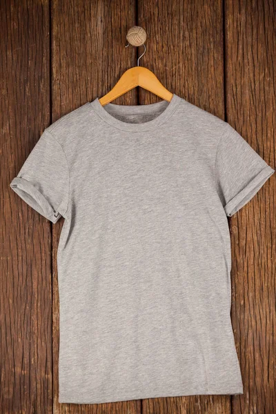 Grey t-shirt on hanger — Stock Photo, Image