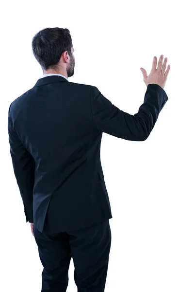 Businessman pretending to touch an invisible screen — Stock Photo, Image