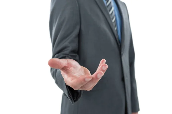 Businessman gesturing against white background — Stock Photo, Image