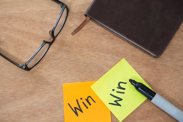 Win written on sticky note with marker — Stock Photo, Image