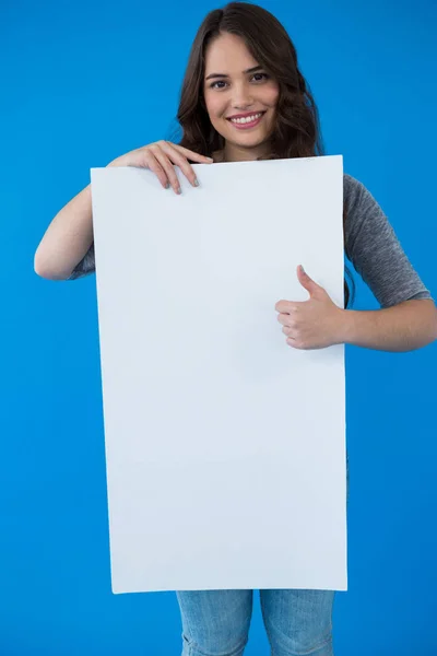 Woman holding a blank placard — Stock Photo, Image